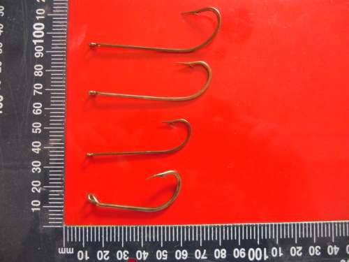 APPROXIMATELY 900 HOOKS (NEVER BEEN USED).